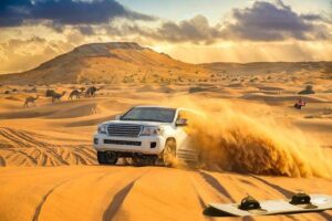 Desert Safari Dubai sunset over golden sand dunes