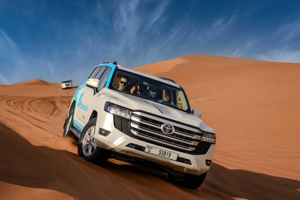 Desert Safari Dubai sunset over golden sand dunes