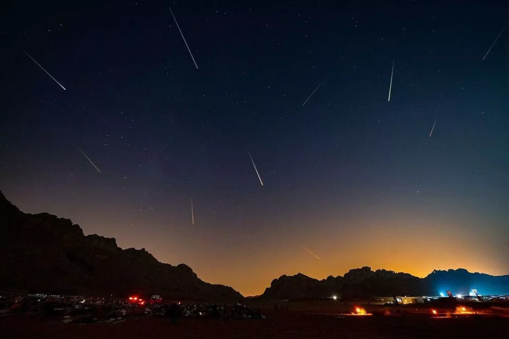 Perseid meteor shower shooting stars over desert